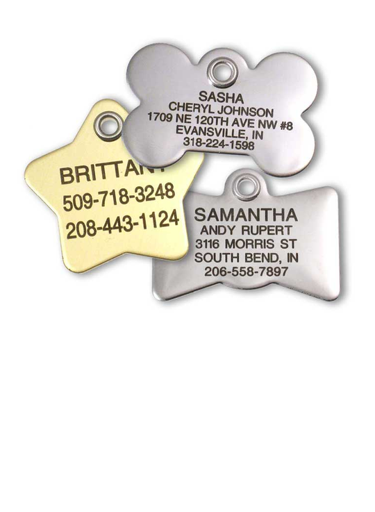 A stainless bone metal tag, brass star metal tag, and stainless bow tie metal tag, all custom engraved with a pet name and owner contact info.