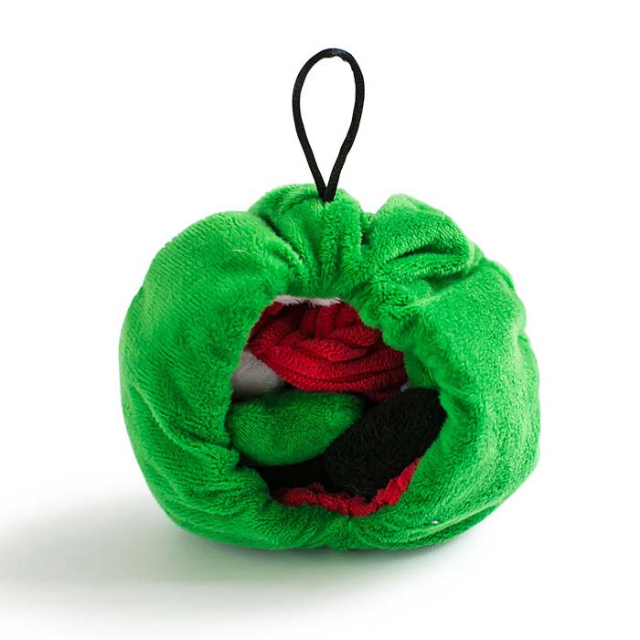 Plush toy turned inside out which now looks like a green ball christmas tree ornament.