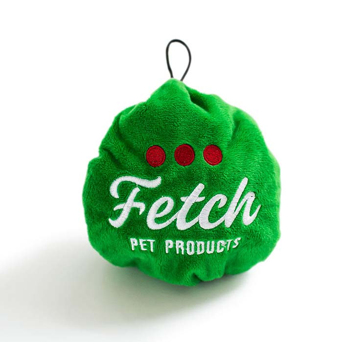 Plush toy turned inside out which now looks like a green ball christmas tree ornament.